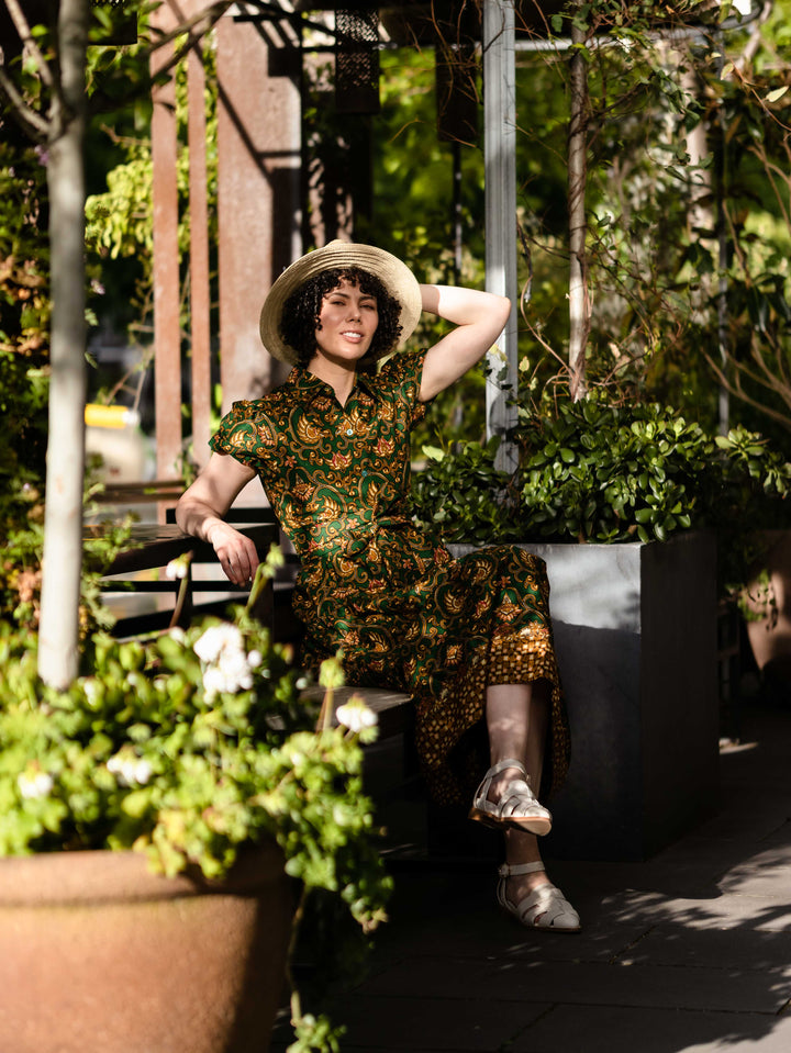 Batik Midi Dress Aulia sitting outside